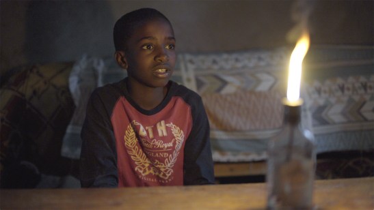 Joshua home at might talking with his grandmother.