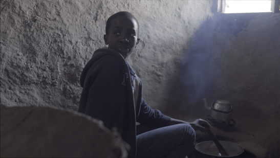 Joshua cooking breakfast.