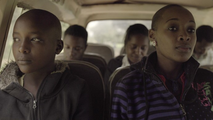 Afiya (Caren) on the left and her sister Lindia (Whitney) on the right on their way home from the clinic.